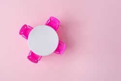 Top view of pink chairs with  table in pastel pink room