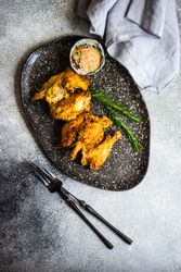 Top view plate of grilled chicken with rosemary