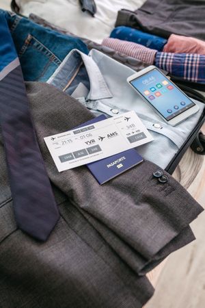 Boarding pass and passport in businessman's suitcase