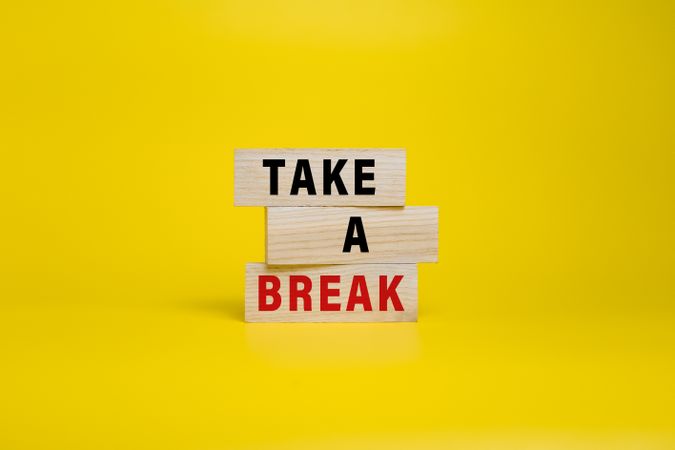 take a break words on wooden blocks isolated on yellow background