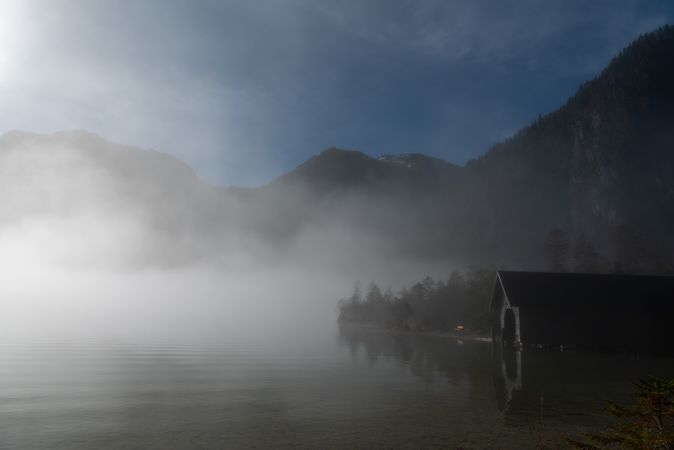 Autumn landscape with Lake Konigsee on a foggy morning