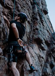 Man climbing a cliff