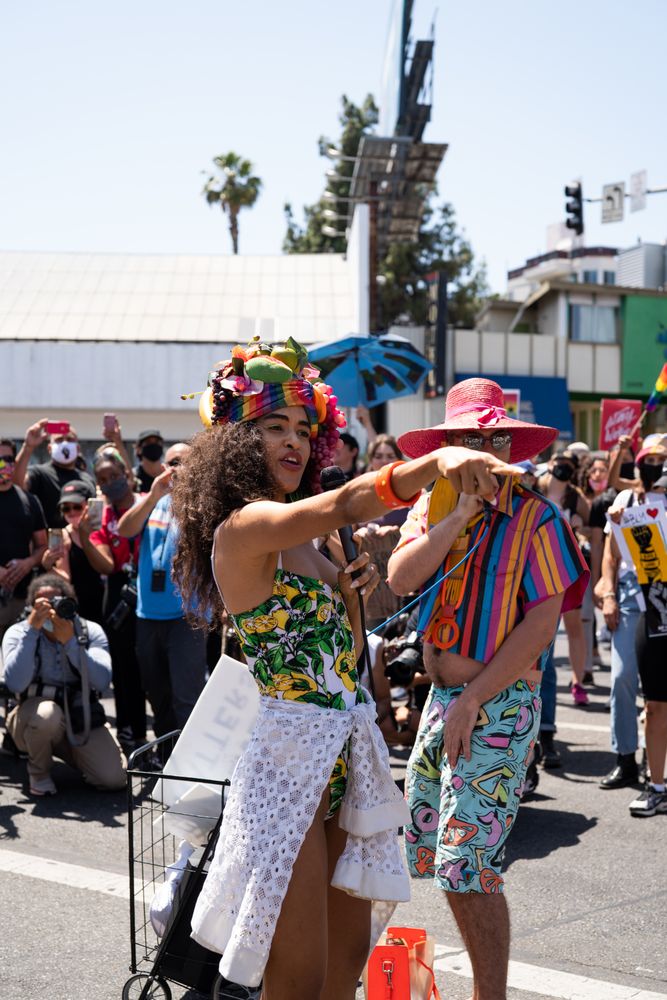 Los Angeles, CA, USA — June 14th, 2020: person singing to crowd on the street pointing at someone