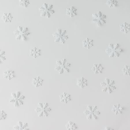 Winter snowflake pattern on light background