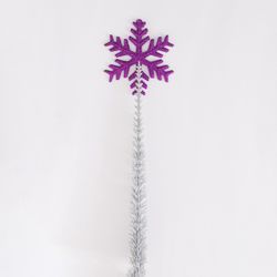 Violet snowflake on a silver frozen branch