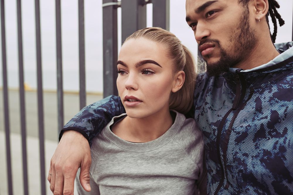 Attractive couple looking away with distracted facial expressions