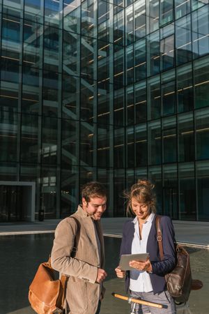 Businesspeople talking on street after work