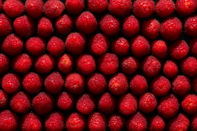 Raspberries above view, full frame background