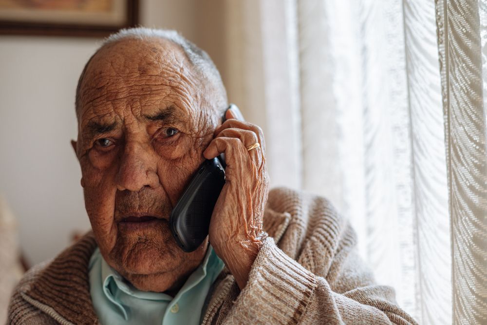 Older man calling from his phone
