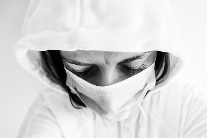 Grayscale photo of doctor in PPE