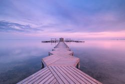Wooden pier on cloudy evening