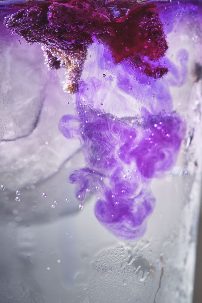 Ice with lilac colored tonic