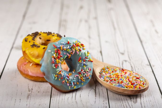 Delicious assorted colorful donuts on the table.