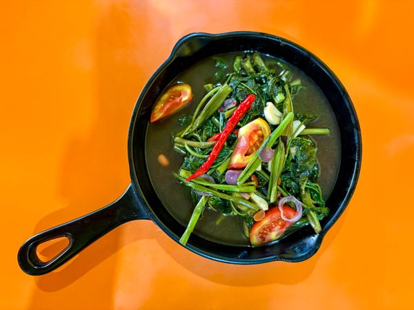Stir-Fried Water Spinach with Chili, Tomato, and Shallots – Top View