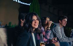 Smiling brunette woman at a party