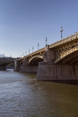 Margaret Bridge in Budapest photographed from the shore on clear day, vertical