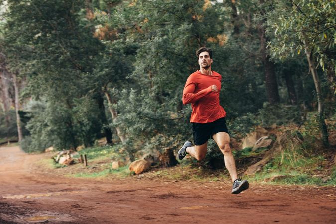 Man running on mud track