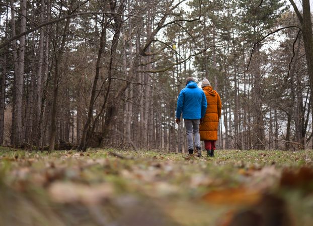 A couple walking and talking in a park
