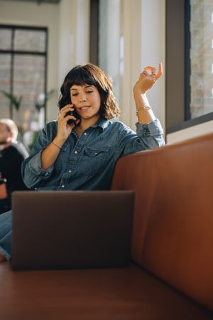 Business woman using mobile phone in office