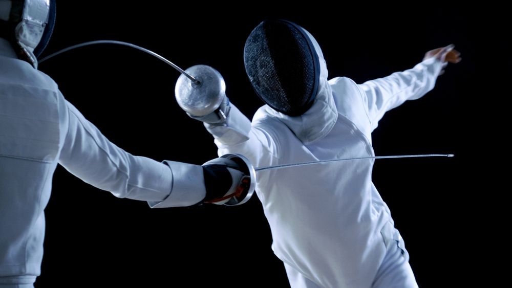 Two Professional Fencers Show Masterful Swordsmanship in their Foil Fight.