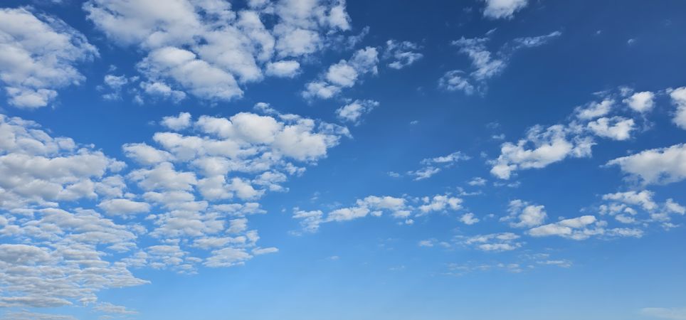 Blue sky with fluffy clouds