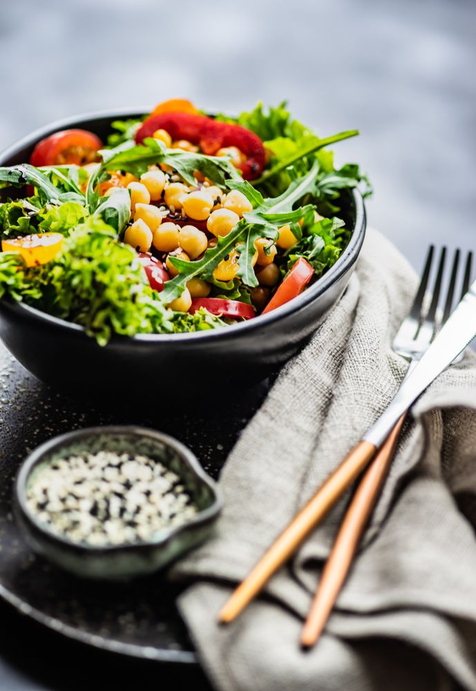 Organic vegetable salad with garbanzo beans and sesame seeds