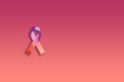 One pink ribbon on gradient pink background