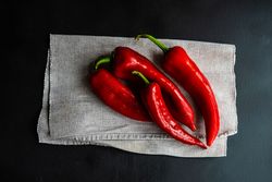 Fresh red peppers drying on napkin