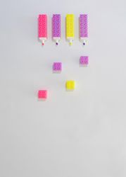 Flat lay of four highlighters with their caps off