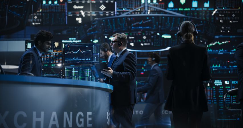 Cinematic Portrait with Handsome Diverse Stock Exchange Brokers at Work.
