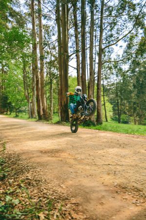 Man with helmet riding custom motorbike