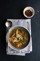 Spiral pasta and chicken or turkey on blue napkin