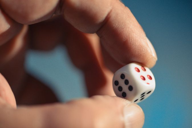 Close up of die for a game in someone’s hands