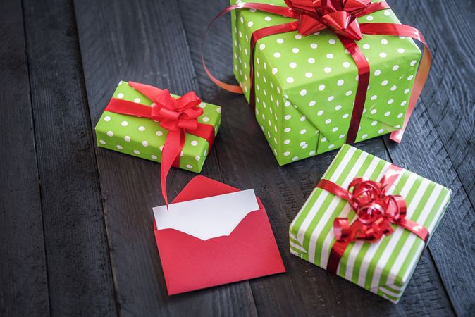 Cheerful wrapped presents and opened letter