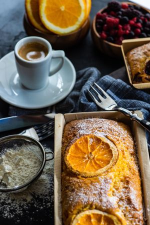 Freshly baked orange cake with espresso shot