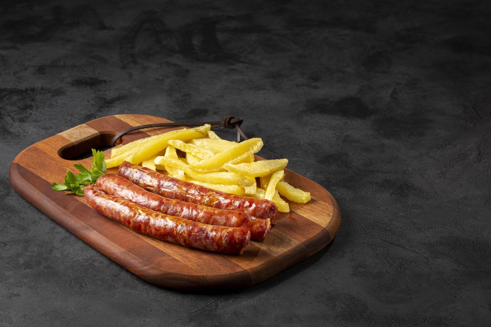 Grilled German sausage with french fries.