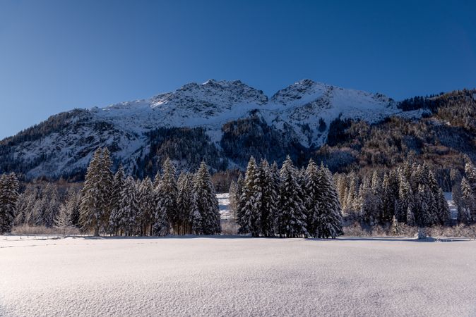 Bavarian Alps valley covered in snow on a sunny day in December