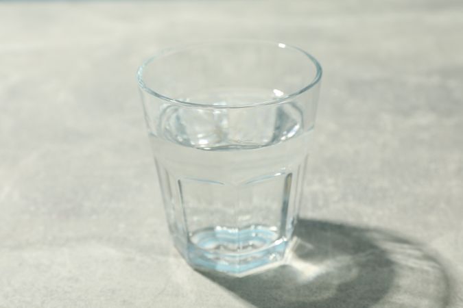 Full glass of water on marble table