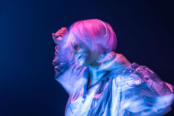 Woman dancing while listening to music
