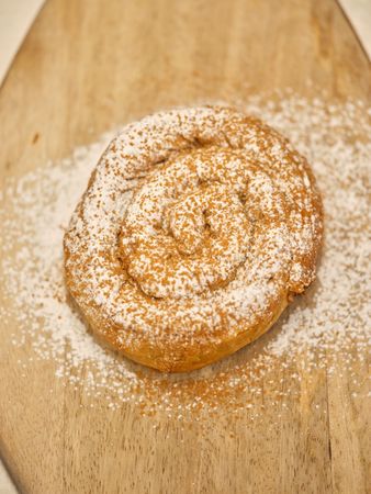 Pastry on cutting board in bakery