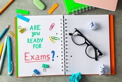 Composition with school supplies on grey background, top view