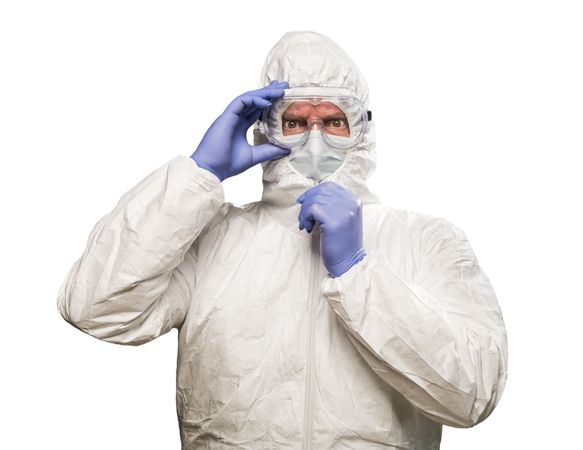 Man With Intense Expression Wearing HAZMAT Protective Clothing Isolated On A Blank Background.