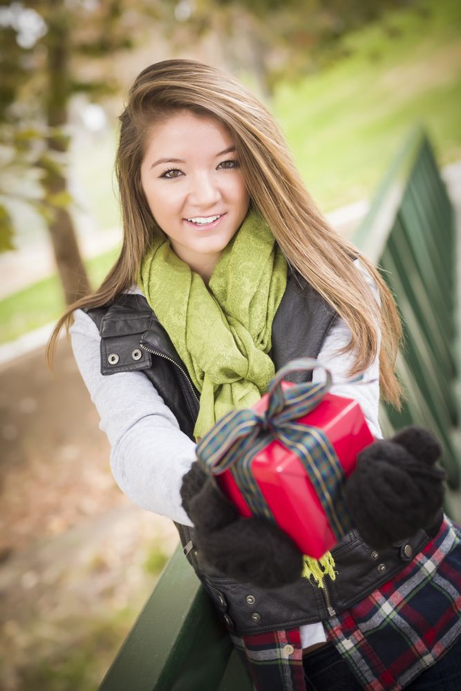 Woman with Wrapped Gift with Bow Outside