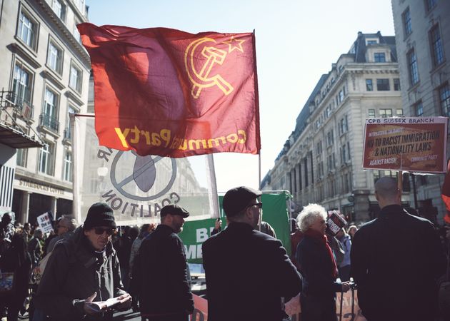 London, England, United Kingdom - March 19 2022: Communist party flag at protest