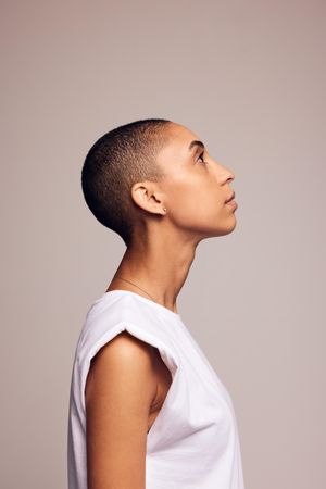 Side view of a female in casuals with shaved head