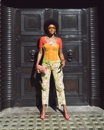 London, England, United Kingdom - September 15th, 2019: Fashion forward woman poses in front of door