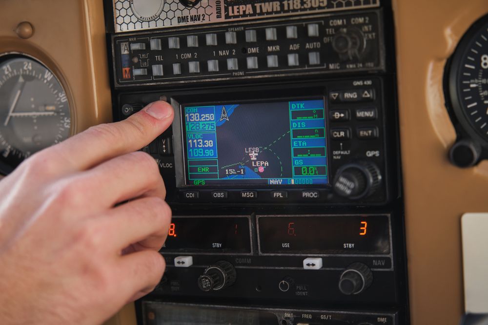 Anonymous man pushing button in aircraft cockpit