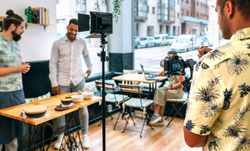 Cameraman recording a cooking tutorial that is broadcast live