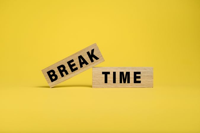 break time words text on wooden blocks isolated on yellow background