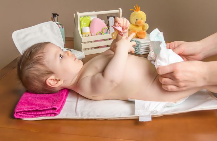 Parent fastening diaper of baby